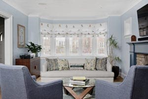 Couches by fireplace in family room setting